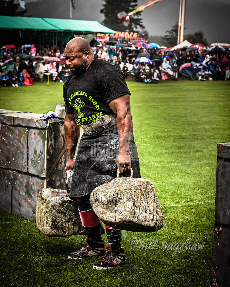 Mark Felix one of the worlds strongest men lifts The Dinnie Stanes ( Dinnie Stones ) at Aboyne Highland Games on Royal Deeside (Bill Bagshaw/M. Williams)